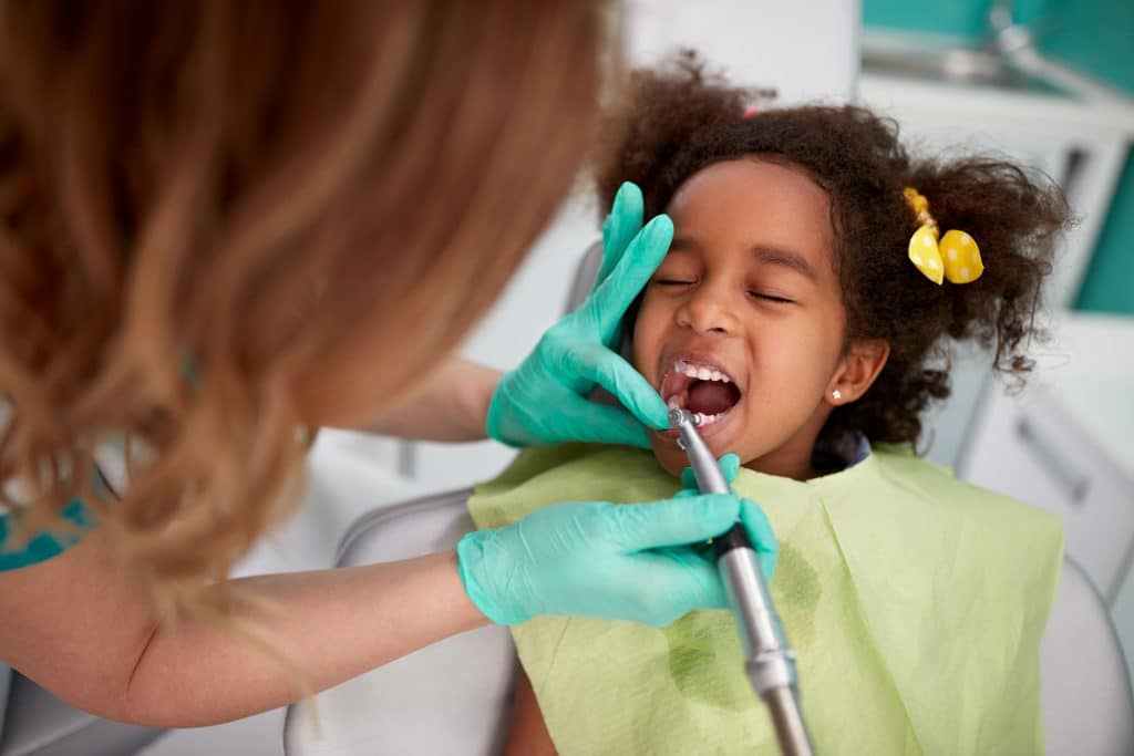 young girl at dentist